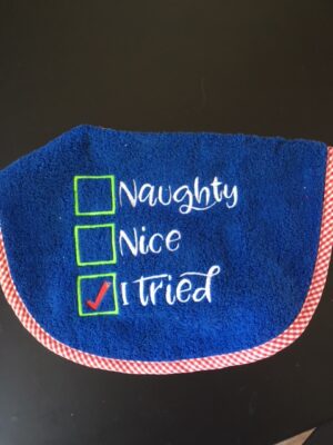 Adult Bib with slogan " Naughty Nice I Tried"
