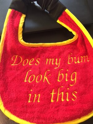 Adult Bib in Red with slogan "Does my bum look big in this"