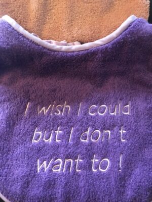Adult Bib in purple with slogan "I wish I could but I don't want to"