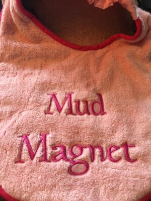 Adult Bib with slogan "Mud Magnet"